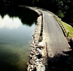 Another view of Boone Dam next to calm water 