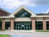 Hlae Middle School entrance with parking area in front