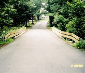 Hiley Brook Road Bridge - view from driver's seat with wooden guardrails on both sides