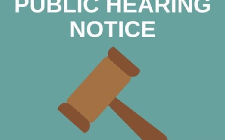 Public Hearing Notice with a brown gavel on a blue-green background